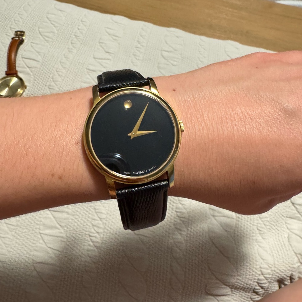Movado Black and Gold Smartwatch with Sleek Design